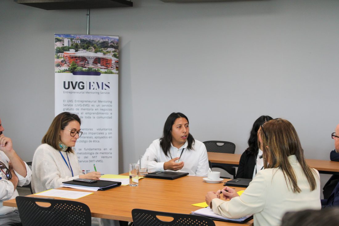group of people talking at a table