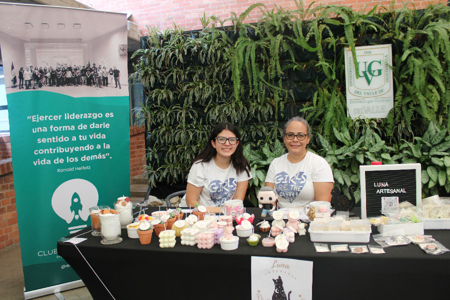 Two women at a table with artisanal products