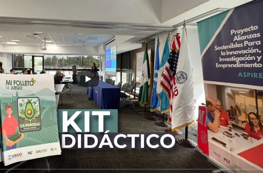 room with flags of USA, USAID, Guatemala, UVG, and the cover of the toolkit and ASPIRE's banner visible