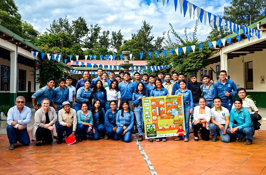 Students and teachers outside displaying the gameboard.