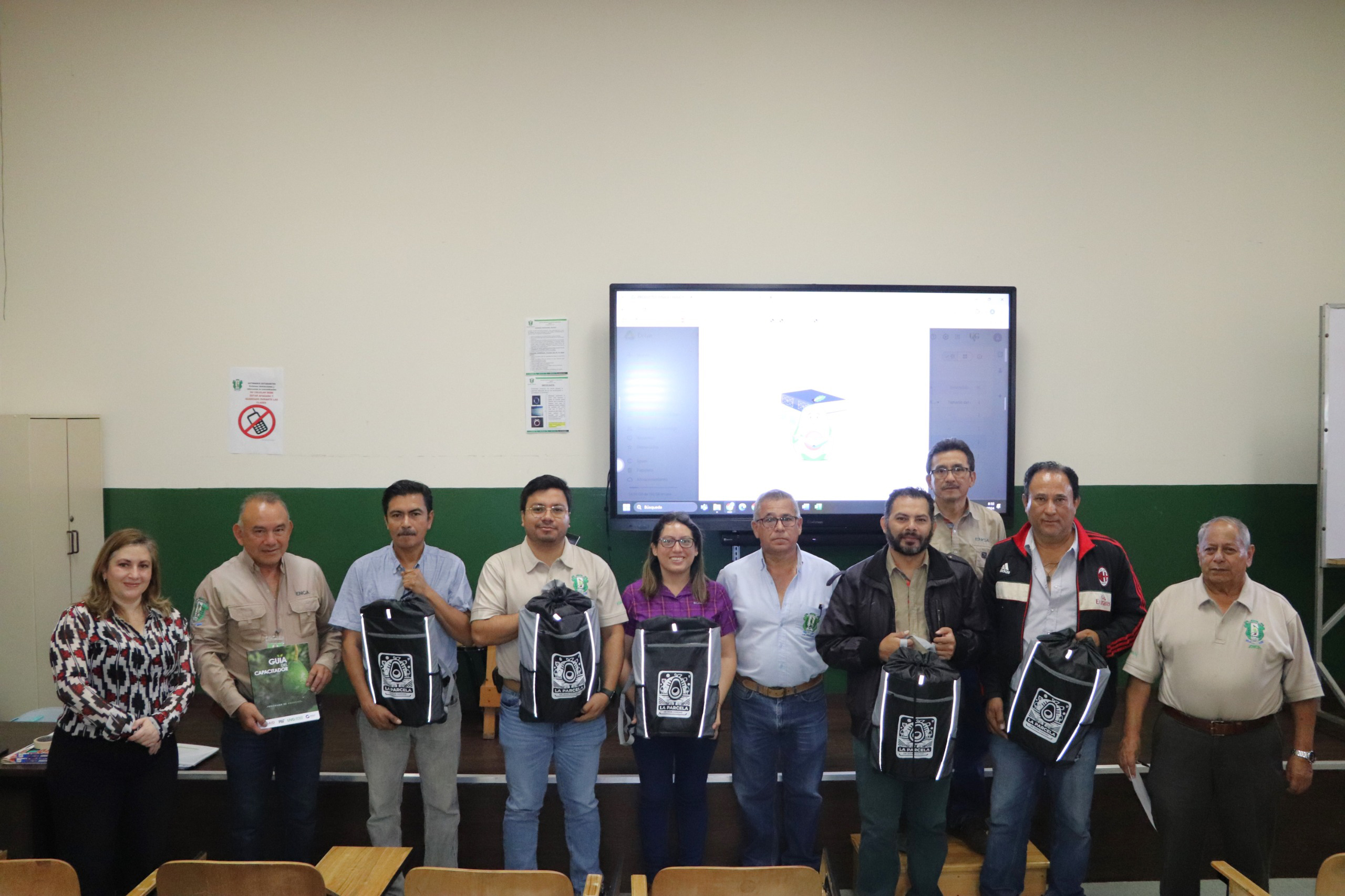 Ten people holding bags in the front of a class