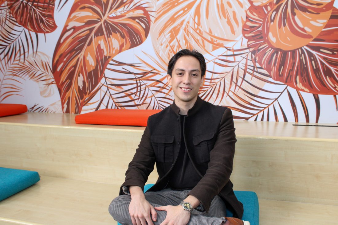 Man sitting smiling at camera